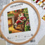 Set de brodat în cruciuliță LetiStitch - Odihna lui Moș Crăciun lângă șemineu, L8052
